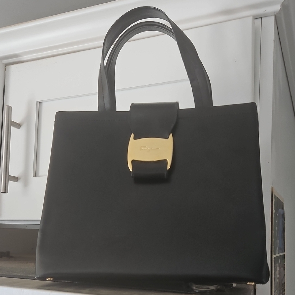 Elegant Black Handbag with Gold Accent